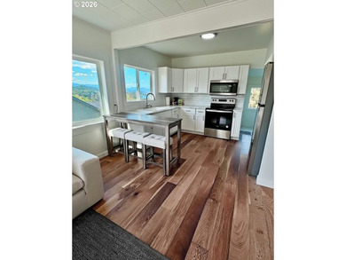 Perched above charming downtown Nehalem, this remodeled coastal - photo 5