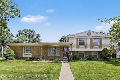 Tucked into East Lansing's beloved Pinecrest neighborhood, this - photo 1