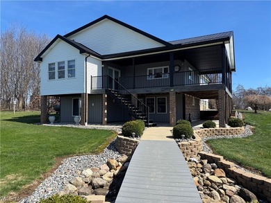 This beautiful, custom home is definitely one of a kind. Walk - photo 1