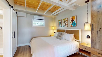 Welcome to this rare, income-producing waterfront retreat in - photo 12