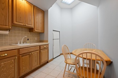 The main level offers 1,365 square feet, providing four offices - photo 12