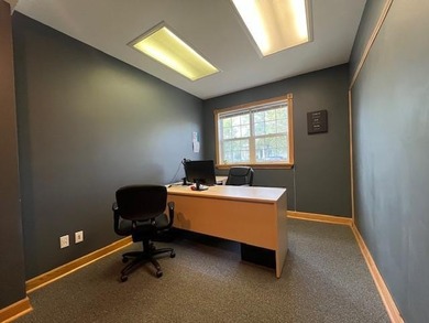 The main level offers 1,365 square feet, providing four offices - photo 14