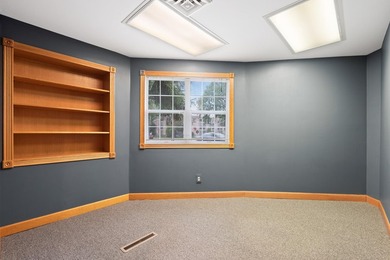 The main level offers 1,365 square feet, providing four offices - photo 15