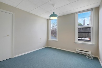 The main level offers 1,365 square feet, providing four offices - photo 21