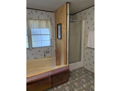 Welcome to 5+ private acres in New Ellenton! This spacious 3