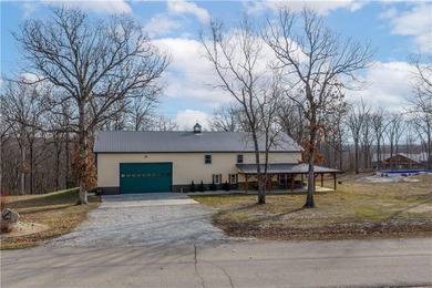 This expansive residence in Warsaw, MO, offers a harmonious - photo 1