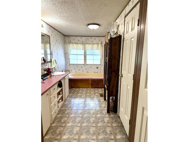 Welcome to 5+ private acres in New Ellenton! This spacious 3