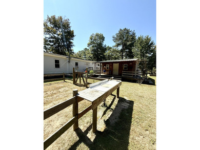 Welcome to 5+ private acres in New Ellenton! This spacious 3