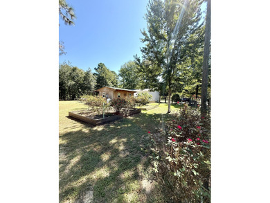 Welcome to 5+ private acres in New Ellenton! This spacious 3