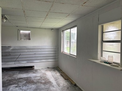 This property is zoned commercial but has been vacant for a time - photo 4