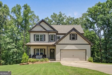 Nestled on a wooded 0.85 acre lot, this like new 4 bedroom, 2.5 - photo 1