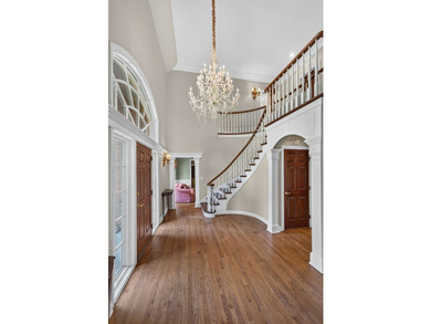 Nestled among mature trees and professionally landscaped grounds - photo 2