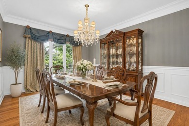 Nestled among mature trees and professionally landscaped grounds - photo 5