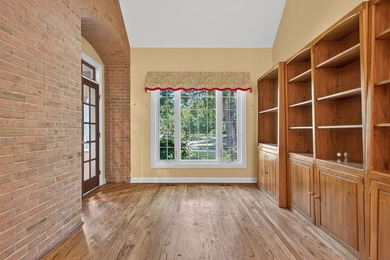 Nestled among mature trees and professionally landscaped grounds - photo 8