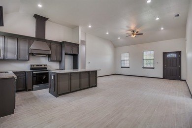 Welcome to this stunning new construction home featuring an open - photo 8