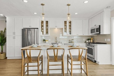 Wake up to sweeping bayfront views in this beautifully updated - photo 14