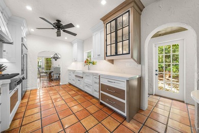 This iconic 1920's Mediterranean Revival Home blends historic - photo 15