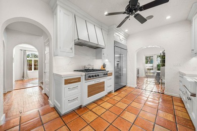 This iconic 1920's Mediterranean Revival Home blends historic - photo 16