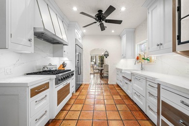 This iconic 1920's Mediterranean Revival Home blends historic - photo 17