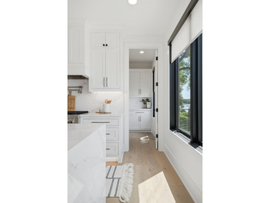 Experience exceptional lakefront living on the highly - photo 22