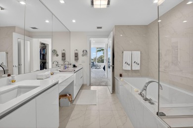 Dazzling golf and sparkling lake views await in this stunning