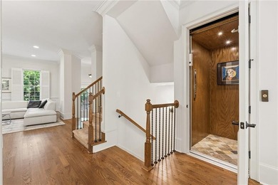 Set behind the gates of One Ivy Walk, this brick townhome offers - photo 3