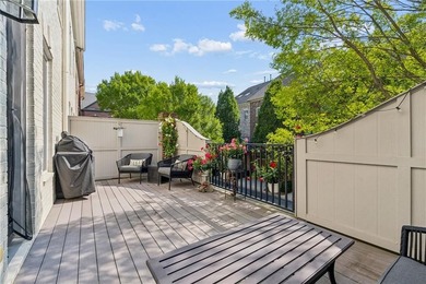 Set behind the gates of One Ivy Walk, this brick townhome offers - photo 5