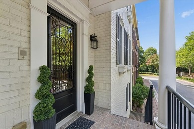 Set behind the gates of One Ivy Walk, this brick townhome offers - photo 7