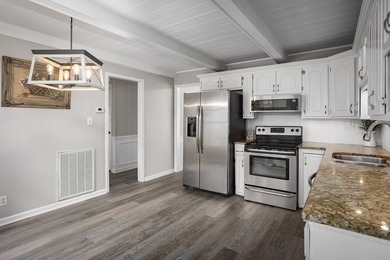 Enjoy lakefront living on Wilson Lake with 125' of waterfront, a - photo 11