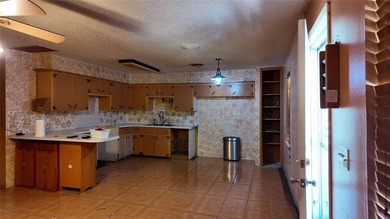 Fixer-Upper Opportunity! Welcome to a home full of potential in - photo 10