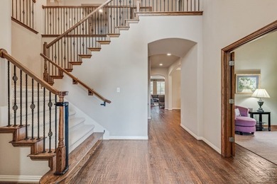 Set beneath mature trees on an oversized one-third-acre lot in - photo 9