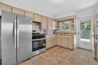 Refreshed and charming 3-bedroom tri-level brick home features a - photo 7