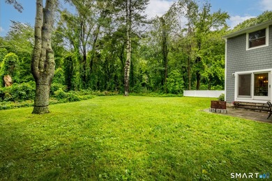 Centrally located yet private, this impeccably maintained - photo 34