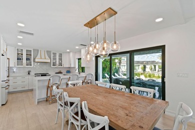 Set on one third of an acre with 90 feet of seawall just off the - photo 12