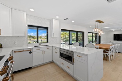 Set on one third of an acre with 90 feet of seawall just off the - photo 15