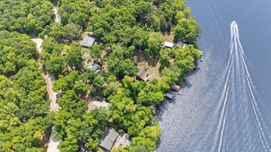 Lakefront home with a cozy living room with vaulted ceiling and - photo 5