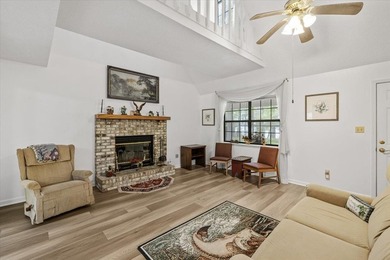 Lakefront home with a cozy living room with vaulted ceiling and - photo 6