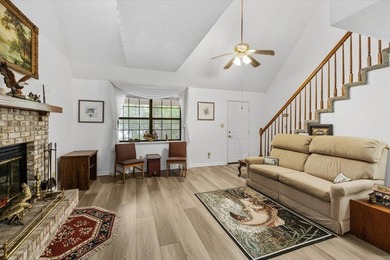 Lakefront home with a cozy living room with vaulted ceiling and - photo 8