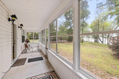 Lakefront home with a cozy living room with vaulted ceiling and - photo 10
