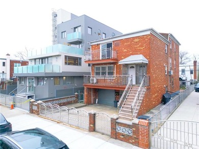 Introducing a beautifully maintained brick two-family home in - photo 3