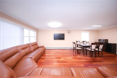 Introducing a beautifully maintained brick two-family home in - photo 6
