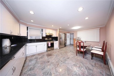Introducing a beautifully maintained brick two-family home in - photo 7