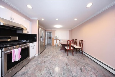Introducing a beautifully maintained brick two-family home in - photo 9