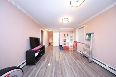 Introducing a beautifully maintained brick two-family home in - photo 10