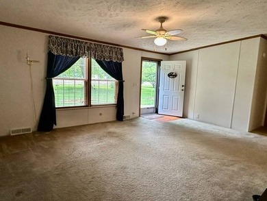 Tucked away in a 1 acre +/- wooded setting, this 3 bedroom - photo 2