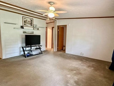 Tucked away in a 1 acre +/- wooded setting, this 3 bedroom - photo 3
