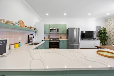 Live the coastal dream and earn from it! This fully renovated - photo 4