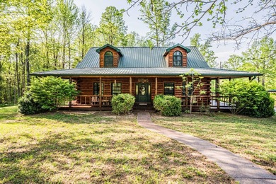 Stunning 3 bedroom, 2.5 bath, 2,200 +/- square foot log home - photo 1