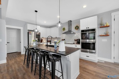 This newer 2023 craftsman style home sits on 16 acres and offers - photo 10