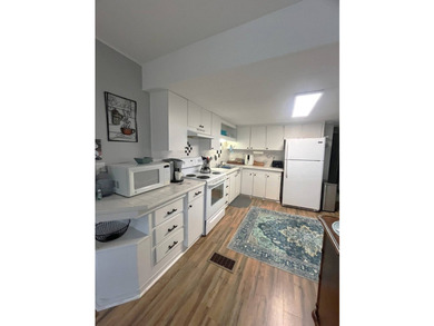 This lovely open-concept home has been beautifully updated with - photo 3